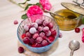 Frozen cherry in a glass vase