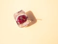 Frozen cherry inside ice cube, summer concept, with copy space
