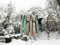 Frozen clothespins hang on the rope. Aligned photo. Colored clothespins for laundry. Royalty Free Stock Photo