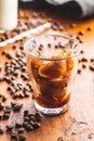 Frozen coffee shaped like heart. Coffee ice cubes in glass cup