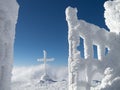 Frozen cross in the mountain