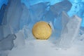 Frozen crypto currency bitcoin face obverse stands surrounded by blue ice in beautiful light. Royalty Free Stock Photo