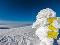 Kor Alps - Frozen directional path marks on idyllic ski tour trail to snow covered mountain peak Grosser Speikkogel on Kor Alps