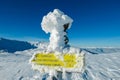 Kor Alps - Frozen directional path marks on idyllic ski tour trail to snow covered mountain peak Grosser Speikkogel on Kor Alps