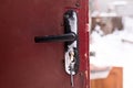 Frozen door lock on old brown doors. Royalty Free Stock Photo
