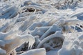 Frozen dried grass vegetations covered with thick layer of hoar frost and white snow on a sunny winter