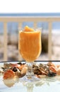 Frozen drink in a footed glass with sea shells Royalty Free Stock Photo