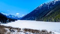 Frozen Duffey Lake and the snow capped peaks of Mount Rohr in BC Canada Royalty Free Stock Photo