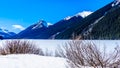 Frozen Duffey Lake wit the snow capped peaks in British Colum Royalty Free Stock Photo