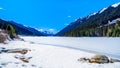 Frozen Duffey Lake wit the snow capped peaks in British Colum Royalty Free Stock Photo