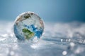 Frozen earth globe. Climate change and long winter concept, planet Earth is covered by ice and snow Royalty Free Stock Photo