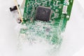 Frozen electonics board for pc in ice Royalty Free Stock Photo
