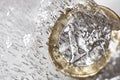 Frozen Euro coin melting