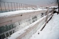 Frozen fence covered in icicles along Lake Michigan in winter Royalty Free Stock Photo