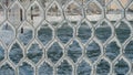 Frozen fence made of metal mesh covered with snowy hoarfrost, winter day Royalty Free Stock Photo