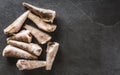 Frozen fillet fishes on slate stone background. Seafood, top view, flat lay, copy space