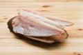 Frozen fillet of pangasius on wooden plate