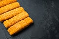 Frozen fish fingers, on black background , with copyspace  and space for text Royalty Free Stock Photo