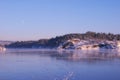 Frozen fjord in the evening with moon Royalty Free Stock Photo