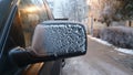 Frozen fog windswept across car mirror