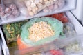 Frozen food in the freezer. Frozen grated cheese Royalty Free Stock Photo