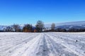 Frozen forest road sprinkled with gravel in foothills of Beskydy mountains in Czech republic. Typical winter day. Countryside view Royalty Free Stock Photo