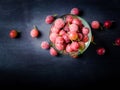 Frozen and fresh berries in a glass pial on a black background. Royalty Free Stock Photo