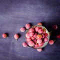 Frozen and fresh berries in a glass pial on a black background. Royalty Free Stock Photo