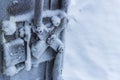 frozen frost on the metal elements of the garage door and lock in extreme cold, the front and rear background is blurred with the Royalty Free Stock Photo