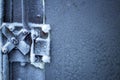 frozen frost on the metal elements of the garage door and lock in extreme cold, the front and rear background is blurred with the Royalty Free Stock Photo