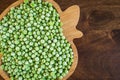 frozen frosty green peas on wooden plate closeup Royalty Free Stock Photo