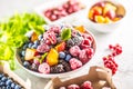 Frozen fruits blueberries blackberry raspberry red currant peach and herbs melissa Royalty Free Stock Photo