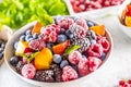 Frozen fruits blueberries blackberry raspberry red currant peach and herbs melissa Royalty Free Stock Photo