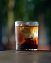 Frozen Glass of cold Alcoholic drink or cocktail. Rum or whiskey with ice cube at table on dark blurred background Royalty Free Stock Photo