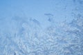 Frozen glass texture. Abstract blue background. Winter frosty patterns on the window Royalty Free Stock Photo