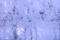 Frozen glass texture. Ice patterns on the window. Christmas blue background Royalty Free Stock Photo