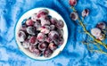 Frozen grapes cluster in the bowl