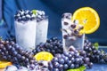 Frozen grapes in glass of water with ice close-up Royalty Free Stock Photo