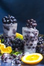 Frozen grapes in ice with orange close-up Royalty Free Stock Photo