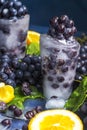 Frozen grapes in ice with orange close-up Royalty Free Stock Photo