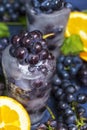 Frozen grapes in ice with orange close-up Royalty Free Stock Photo