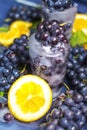 Frozen grapes in ice with orange close-up Royalty Free Stock Photo