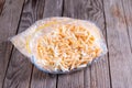 Frozen grated cheese in a package on the table Royalty Free Stock Photo