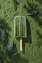 A frozen green matcha popsicle with visible black specks, suggestive of tea leaves Royalty Free Stock Photo