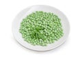 Frozen green peas on dish on a white background Royalty Free Stock Photo