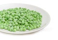 Frozen green peas on the white dish with selective focus Royalty Free Stock Photo