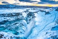 Frozen Gullfoss Falls in Iceland in winter at sunset.