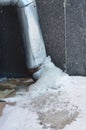 Frozen gutter downspout pipe drain covered ice Royalty Free Stock Photo