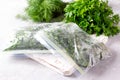 Frozen Herbs dill and parsley in a plastic bag. Concept of healthy eating