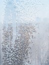 frozen home window pane in cold winter